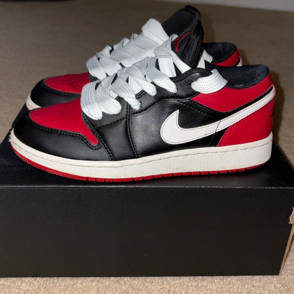 Jordan 1 lows in red and black colorway